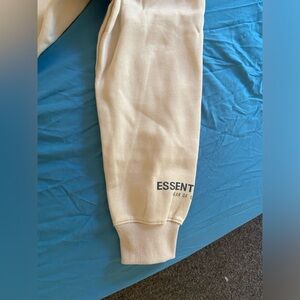 Brand new essentials hoodie color cream